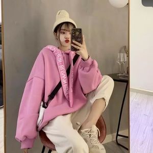 Streetwear style hooded pink sweatshirt